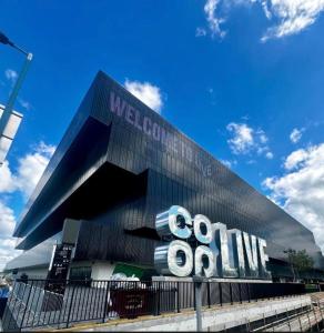 a building with a sign on the side of it at Tomelle Manchester in Manchester