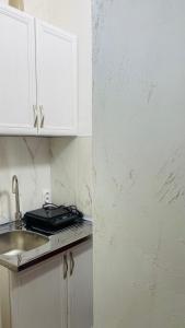 a kitchen with a sink and a counter top at Panorama - 2 Lazarevac in Lazarevac
