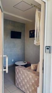 a living room with a couch and a tv at Panorama - 2 Lazarevac in Lazarevac