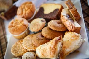 a plate of different types of pastries on a table at Seranides Boutique Hotel in Kato Gatzea