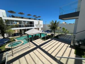 a view of a swimming pool on a building at Pousada WL Império in Canoa Quebrada