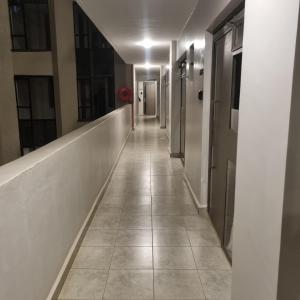 a hallway of an office building with a long corridor at Royalty homes in Kiambu