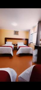 a room with four beds in a room at Kaypi Yireh in Cabanaconde +4 photos