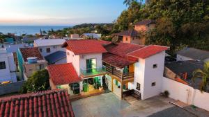an aerial view of a house with red roofs at Pousada Mel e Mar in Penha +28 photos