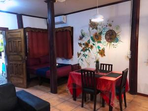 a living room with a table and a couch at Coral Lagoon in Puerto Viejo