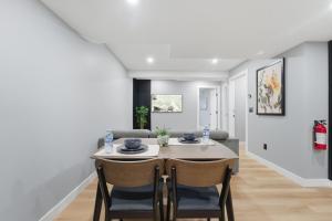 a dining room with a table and chairs at Mountain Escape Deluxe King Suite-Free Parking in Cochrane