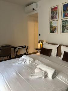 a bedroom with a bed with towels on it at BEDBLUESKY-Sparklingsuite nel centro di Dolceacqua in Dolceacqua +28 photos