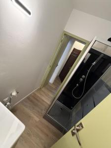 a bathroom with a mirror and a sink at Douce Escale - 1 chambre - literie premium in Calais