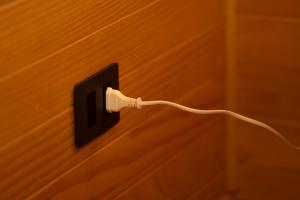 a electrical outlet with a cord plugged into it at Cuyul Lodge in Malalcahuello