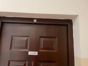 a close up of a door with a sign above it at SkyBreak Apartment in Ledine +3 photos