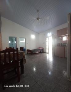a living room with a table and a kitchen at La Leonor in Formosa