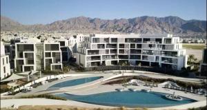 an aerial view of a resort with a pool at Ayla golf in Aqaba +14 photos