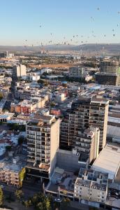 an aerial view of a city with buildings at Suite Privada Zona Norte in Miravalle