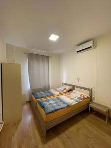 a bedroom with a bed in a room at Atlas Hostel in Skopje