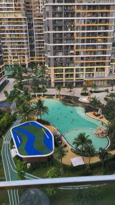 an aerial view of a large swimming pool in a resort at 2 Giường view Bể bơi Family Room with Pool view in Long Bình
