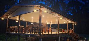 a pavilion with lights on it at night at Konglor cave Resort - River side Restaurant in Ban Konglo