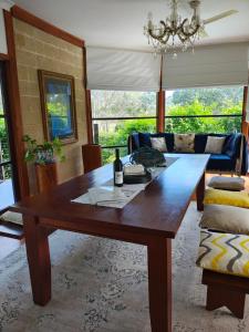 a living room with a wooden table and a couch at Firefly Resort in Firefly