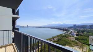 a balcony with a view of a river at Bay Win La,mer Butik in Kota Kinabalu