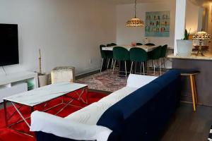 a living room with a couch and a table and chairs at Comfortable Private Room in Toronto
