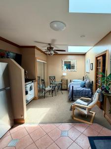 a living room with a kitchen and a living room with a couch at Ocean Breeze Executive Bed and Breakfast in North Vancouver
