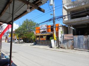 an empty street in front of a store at Sol house in Pajak
