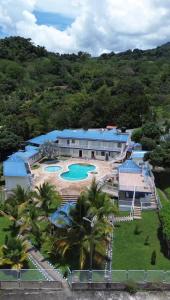 an aerial view of a resort with two pools at Hotel Cabaleón in Tena