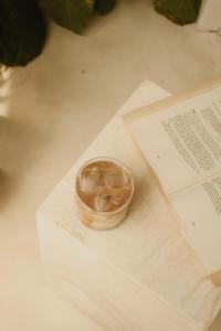 a small wooden bowl sitting on top of some papers at CASA ULU Boutique Hotel - Uluwatu, Adult-only, 6 min to Nyang Nyang beach in Uluwatu