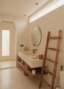 a bathroom with a sink and a mirror and a ladder at CASA ULU Boutique Hotel - Uluwatu, Adult-only, 6 min to Nyang Nyang beach in Uluwatu +71 photos