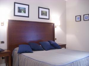 Postel nebo postele na pokoji v ubytování Hotel Taormina