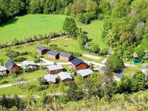 an aerial view of a farm with buildings and trees at Chalet accueillant - 4 pers. - API-1-52-2453 in Meyrueis