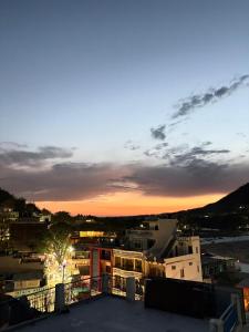 a sunset from the roof of a building at HOTEL O DEV RAJ Homestay in Rishīkesh
