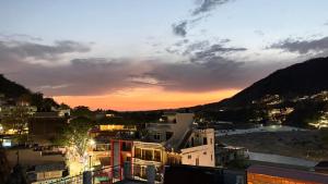 a view of a city at sunset at HOTEL O DEV RAJ Homestay in Rishīkesh