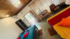 an overhead view of a bedroom with a bed and a chair at Surf Paradise in Tangalle