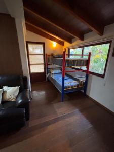 a room with two bunk beds and a couch at Loft familiar campestre en Atlixco in Atlixco +34 photos