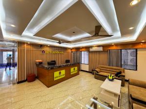 a lobby with a reception desk in a building at Hotel Seven View in Bāiljuri +56 photos