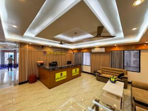 a lobby with a reception desk in a building at Hotel Seven View in Bāiljuri