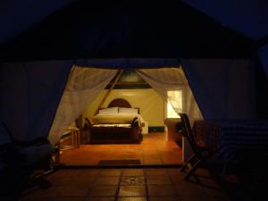 Postel nebo postele na pokoji v ubytování Glamping El Establo