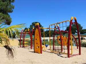 a playground in the sand with a play equipment at Appartement charmant - 4 pers. - API-1-52-2507 in Saint-Hilaire-de-Riez