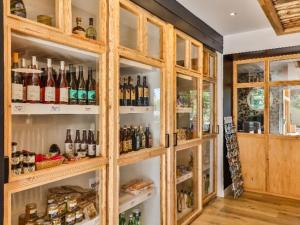 a cabinet filled with lots of bottles of wine at Appartement charmant - 4 pers. - API-1-52-2507 in Saint-Hilaire-de-Riez