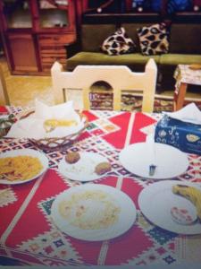 a table with plates of food on top of it at Bob marley luxor in Luxor