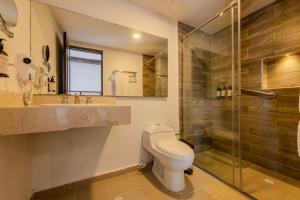 a bathroom with a toilet and a shower at Hotel Dorado Plaza Centro Histórico in Cartagena de Indias
