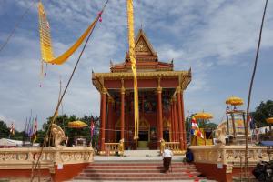 a person standing in front of a building at Authentic Cambodian Angkor Cottage in Siem Reap