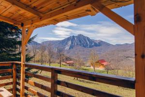 a view of a mountain from the porch of a cabin at Mountain View 2 in Tjentište