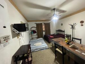 a living room with a table and a bed at Dulce Hogar 2 in La Banda