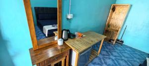 a dressing table with a mirror on top of it at Rainbow Tioman Cottage in Kampong Juara