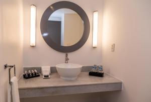 a bathroom with a sink and a mirror at Hotel Casa Ciudad in Mexico City +28 photos