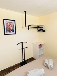 a room with a bed and a cross on the wall at Appartamento Aurora in Orosei +62 photos