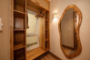 a dressing room with a mirror and a window at La Brise in Ấp Khánh Phước (1) +82 photos