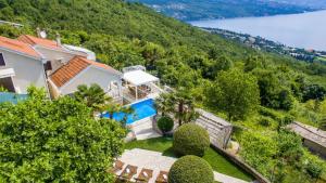 an aerial view of a house with a swimming pool at Vila Iris - Opatija by Villas Guide in Breza