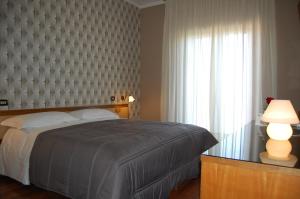Postel nebo postele na pokoji v ubytování Hotel Ristorante Donato